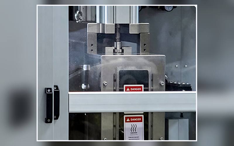 Station 15 Back Release Paper Feeding &amp; Application on a sanitary napkin production line