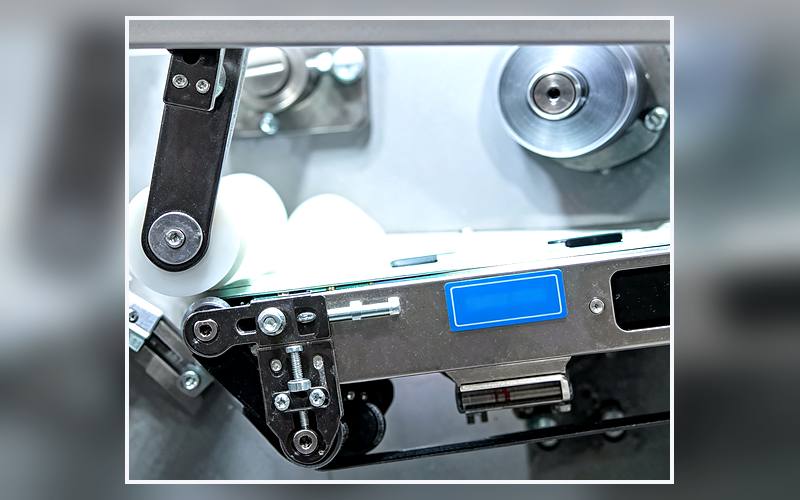 Station 20 Label Feeding &amp; Pouch Sealing on a sanitary napkin production line